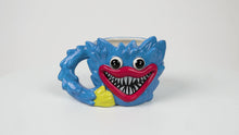 Load and play video in Gallery viewer, POPPY PLAYTIME - Huggy Wuggy 3D Mug (4.5" Ceramic Mug w/ Sculpted Details, 20oz Volume)